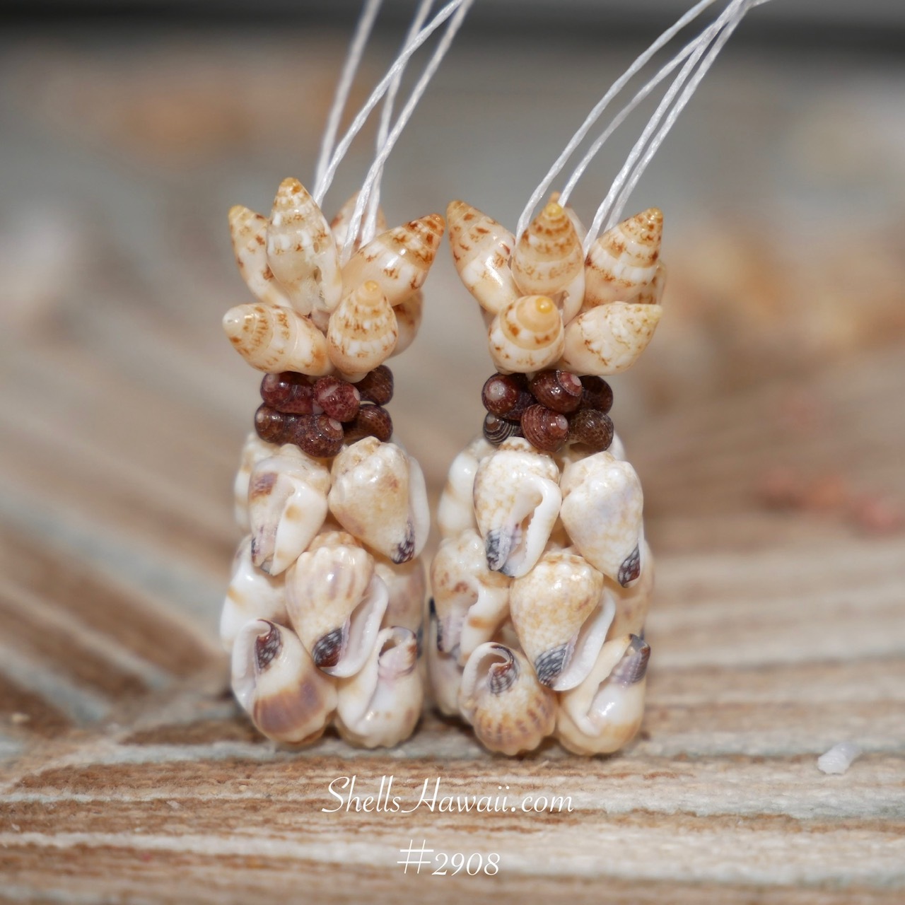 Butter pecan Momi shell earrings with golden Lenalena Laiki and burgundy Kahelelani shells in Hawaiian pineapple design, handmade Niʻihau shell jewelry close-up with natural caramel tones