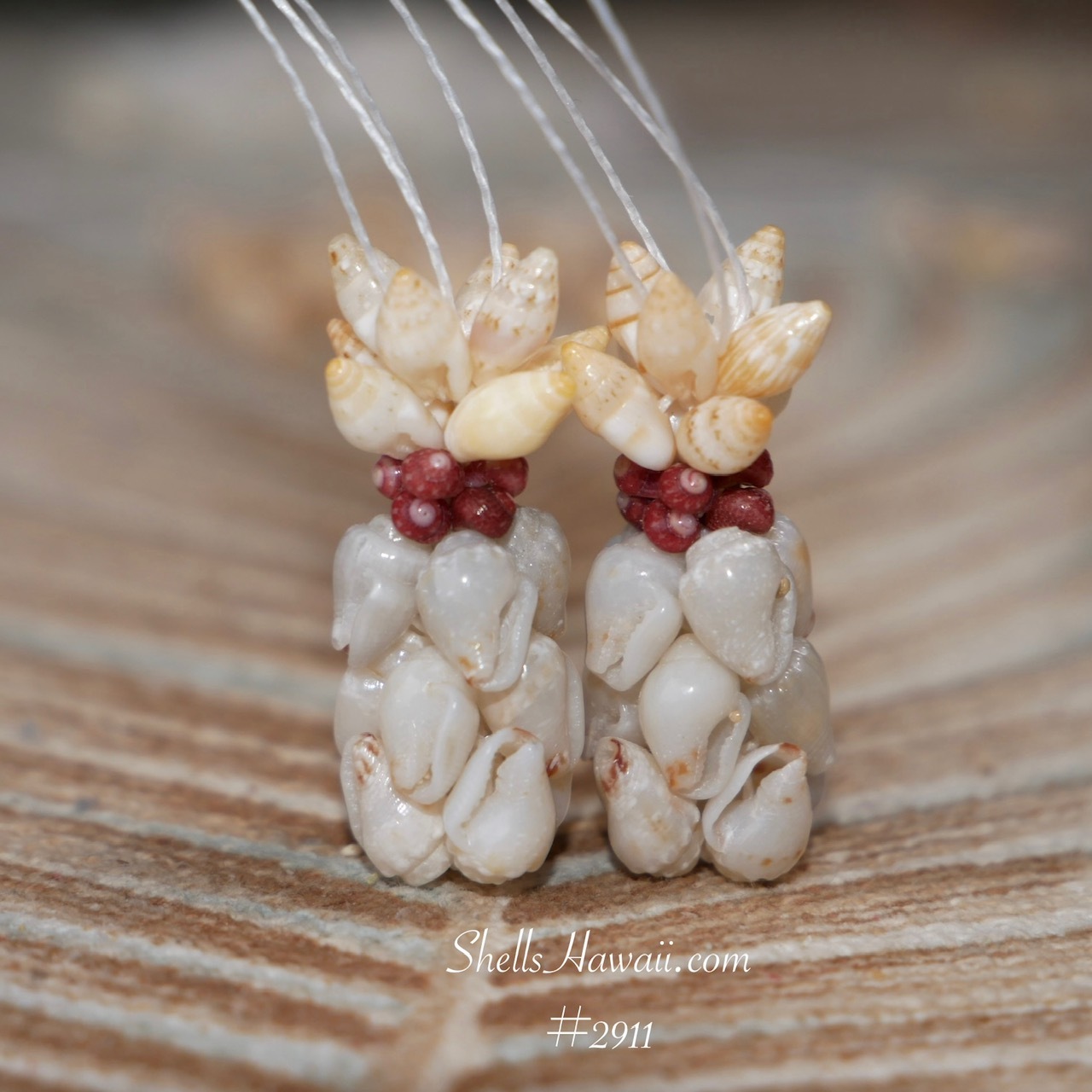 Rare blue ʻŪliʻuli Momi shells with rich golden yellow Laiki shells and red burgundy Kahelelani accents in Hawaiian pineapple design earrings, handmade Niʻihau shell jewelry close-up