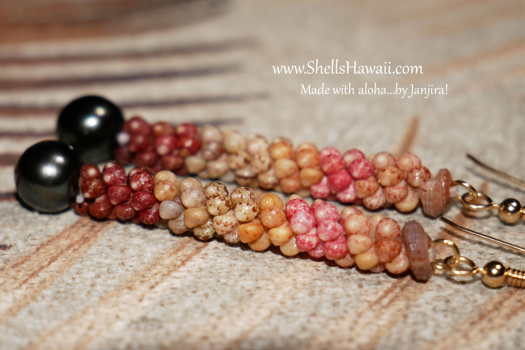Close-up of handcrafted Poepoe style Kahelelani shell earrings with Tahitian pearls, featuring beautiful natural colors from Kauaʻi. A very light application of mineral oil helps bring out the shells' natural color while maintaining their authentic appearance.