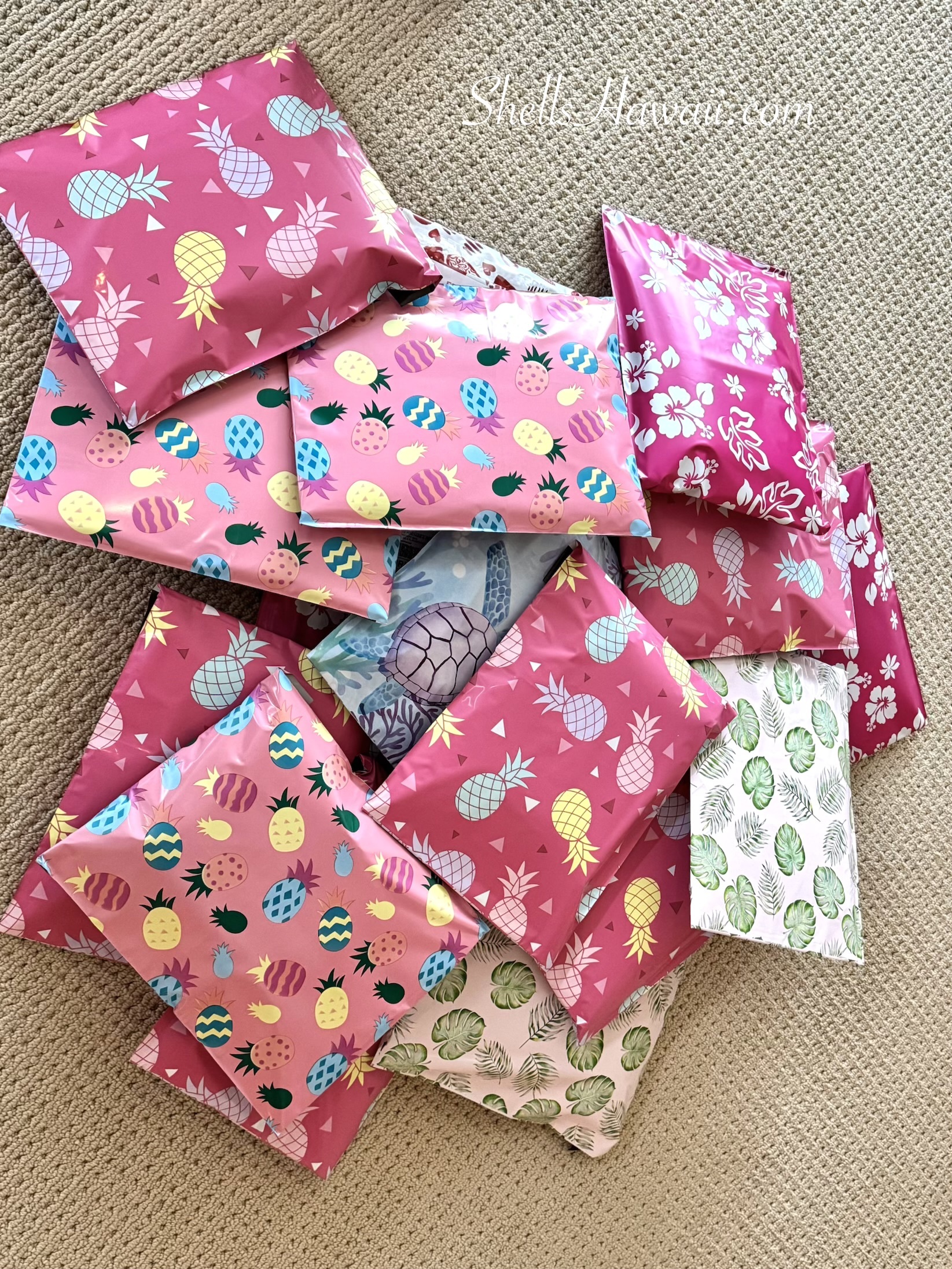 Packing ShellsHawaii customer orders in colorful Hawaiian gift wrapping before shipping authentic Niʻihau shell jewelry