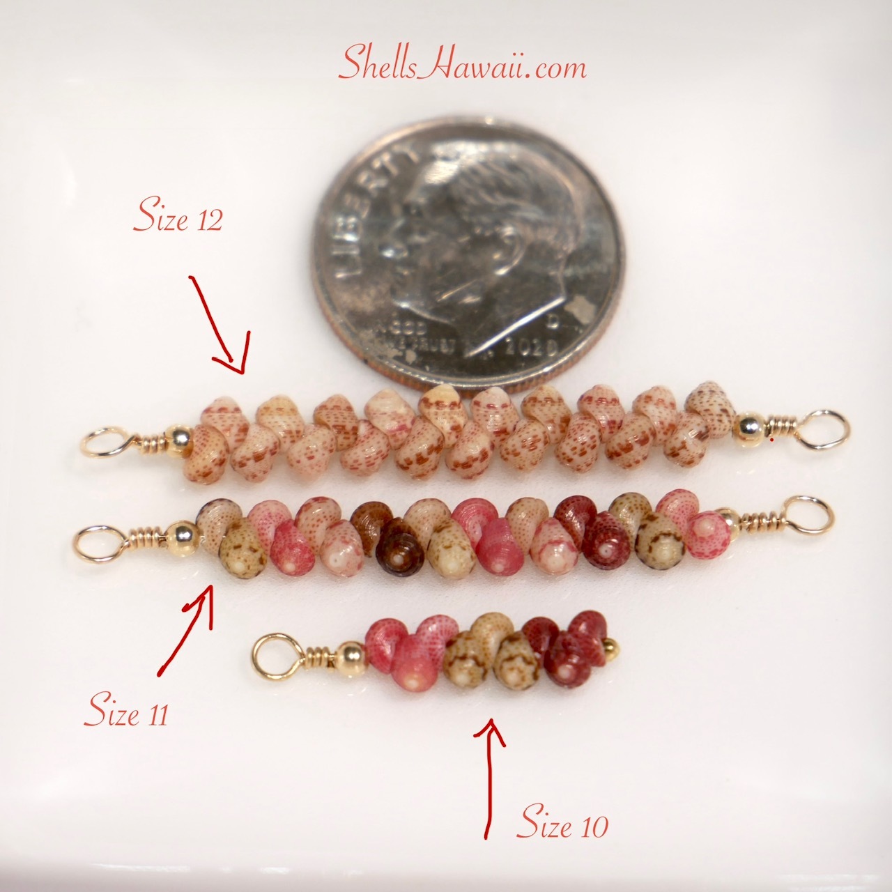 Partial finished minimalist Niʻihau Kahelelani shell jewelry before connecting to a 14K gold filled chain, showing size 10, 11, and 12 shell comparisons next to a dime. The photo highlights how tiny and dainty these shells are and the skill, careful hole placement, and shell size matching required to create clean and consistent minimalist jewelry designs.