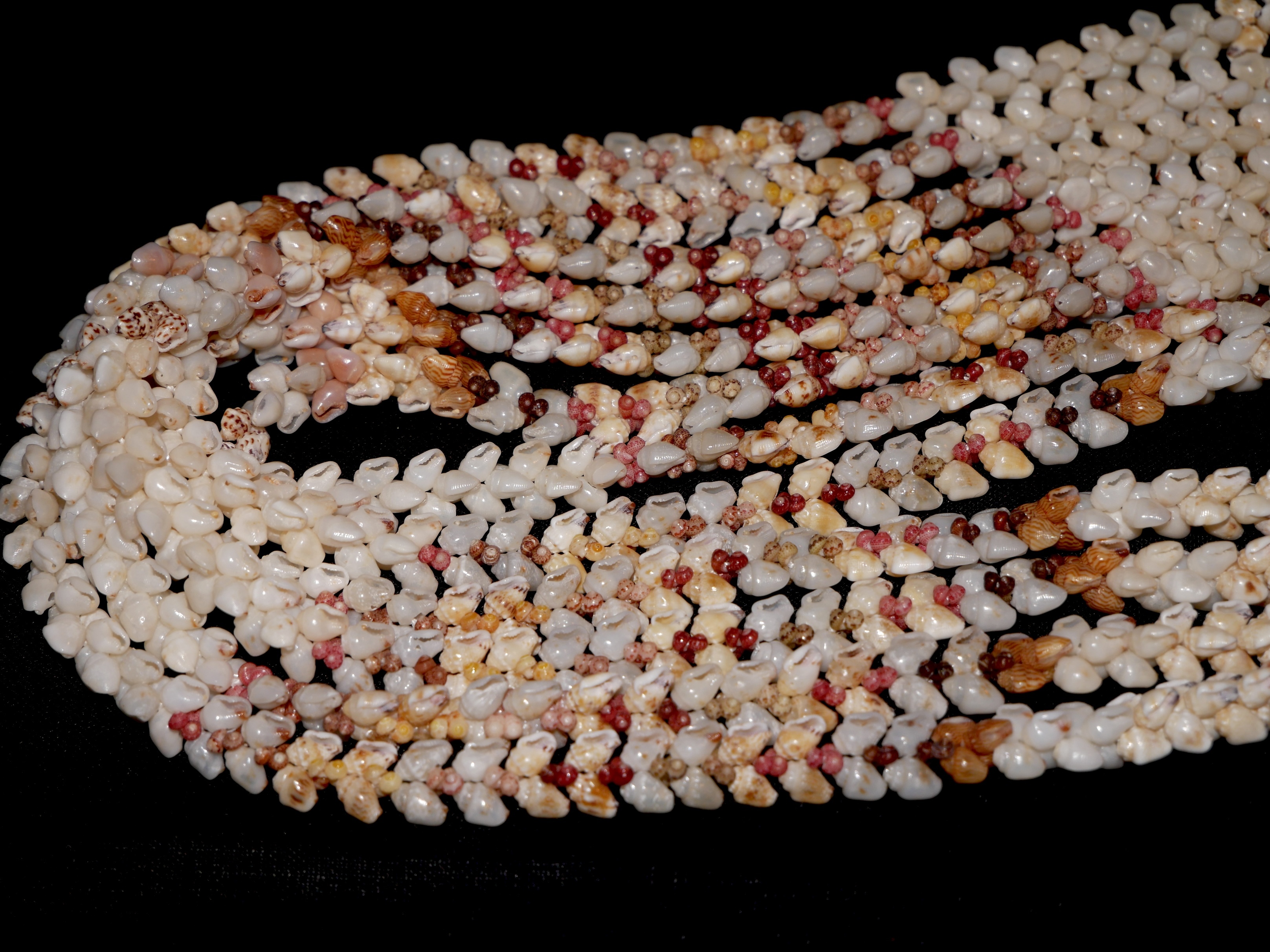 Close-up of Niʻihau shell jewelry showing consistent Momi shell size and precise alignment across strands, highlighting how careful size matching is essential for balance, structure, and quality in finished Hawaiian shell jewelry
