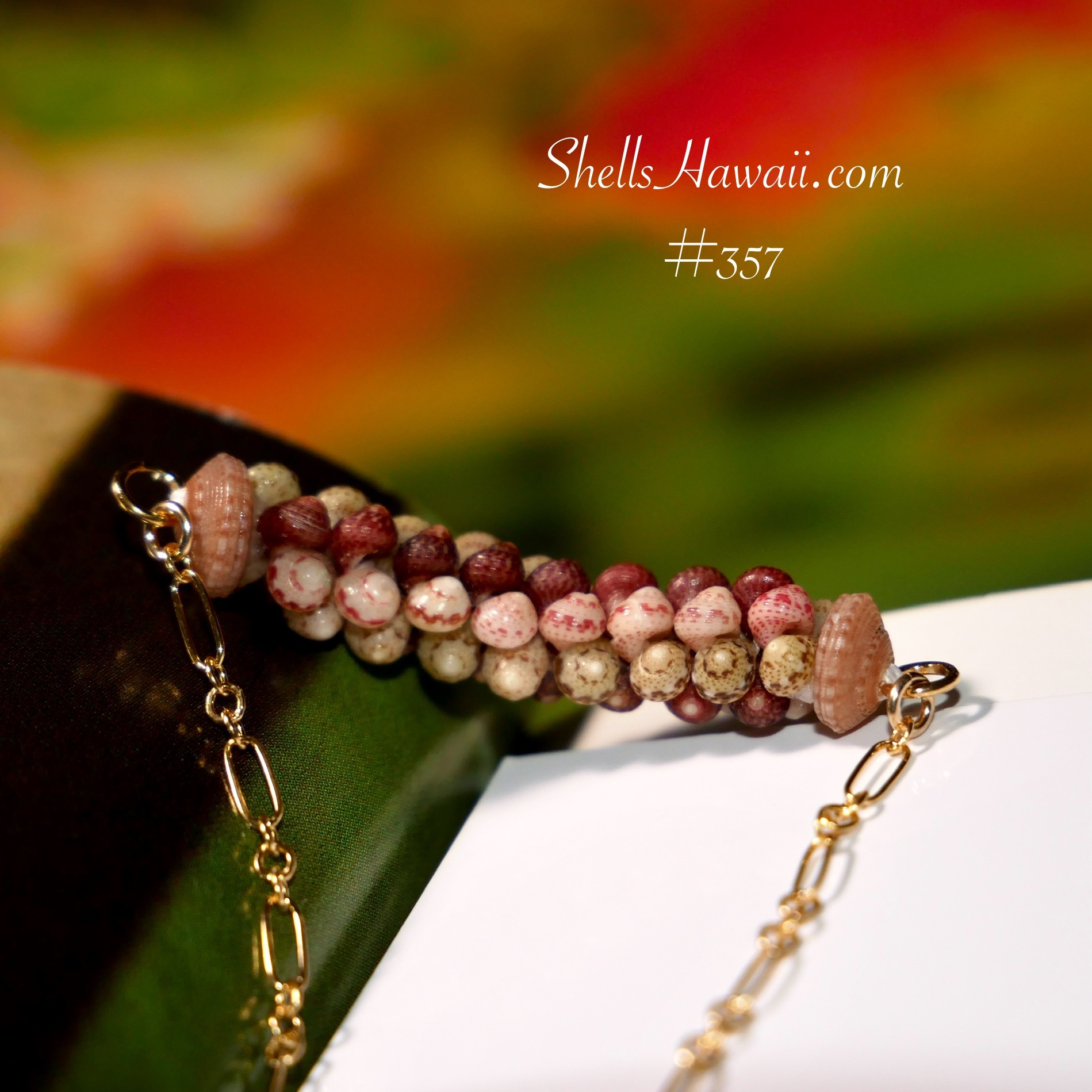 Two-strand Poepoe style Niʻihau shell bracelet made with Kahelelani shells, showing the square rope-like structure and six aligned rows that define the two-strand Poepoe design.