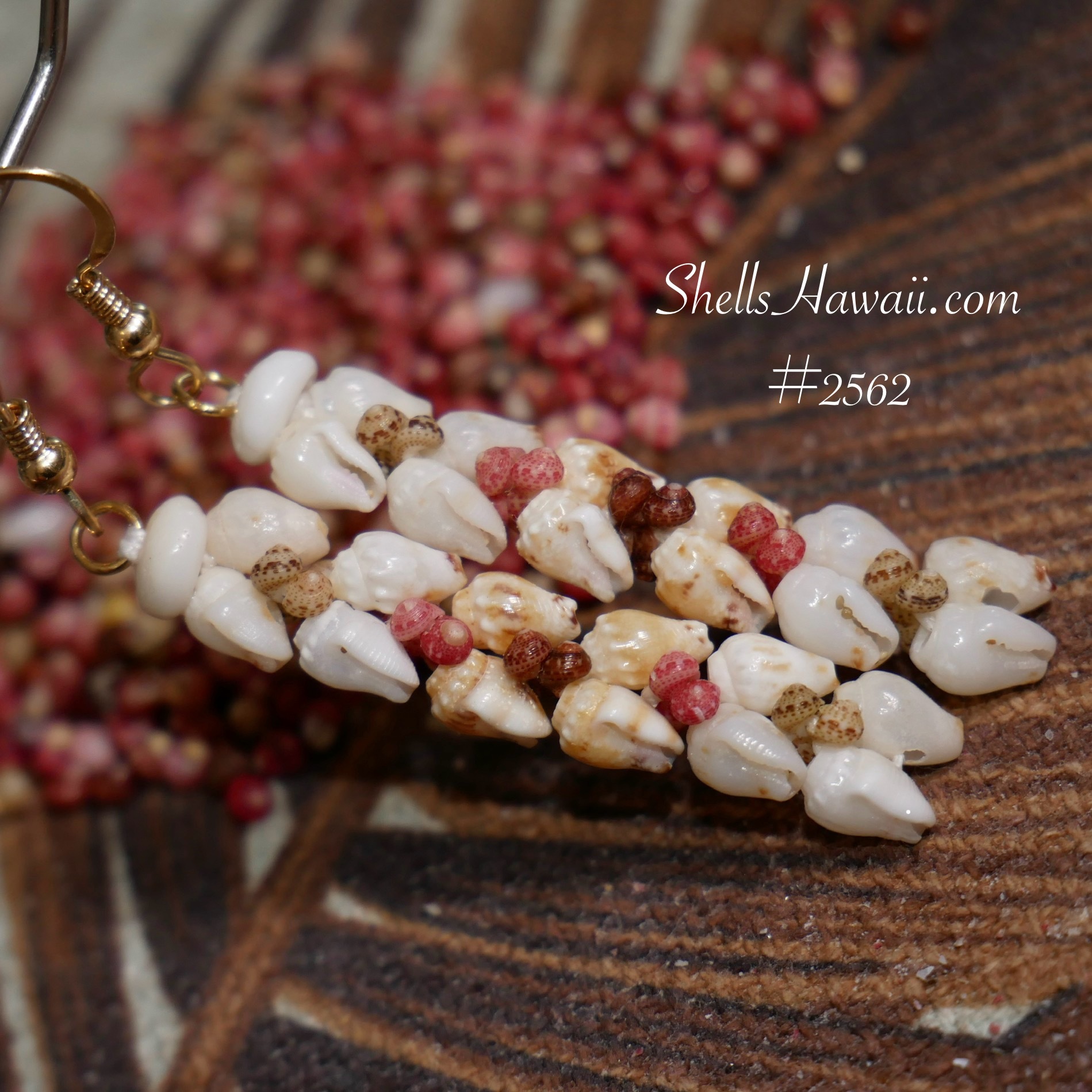 Niʻihau shell earrings in Heleconia style made with Momi and Kahelelani shells, Hawaiian shell jewelry showing how different poking angles create smooth directional flow