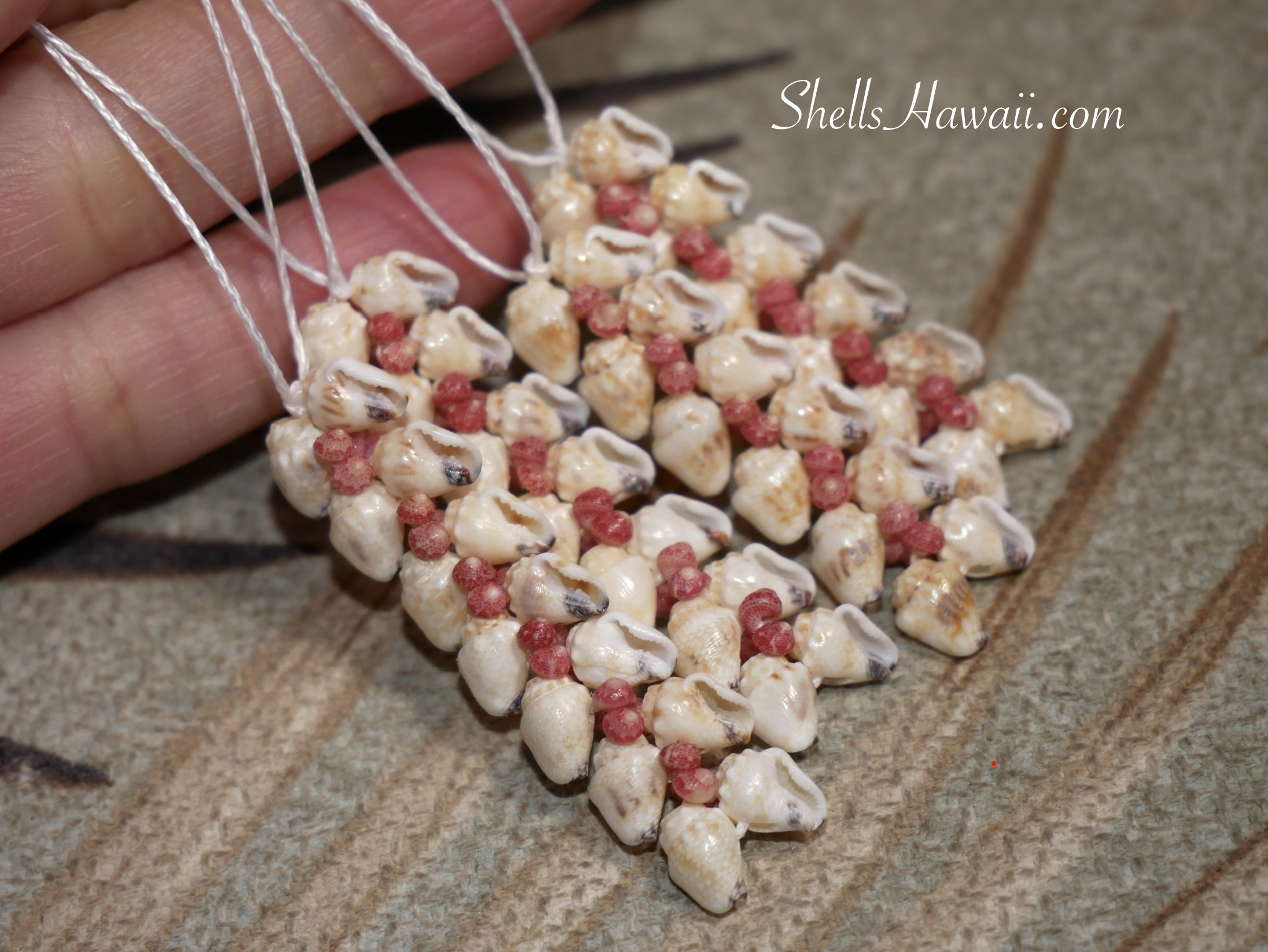Heleconia style Niʻihau shell earrings made with momi shells and pink kahelelani accents, handmade Hawaiian shell jewelry