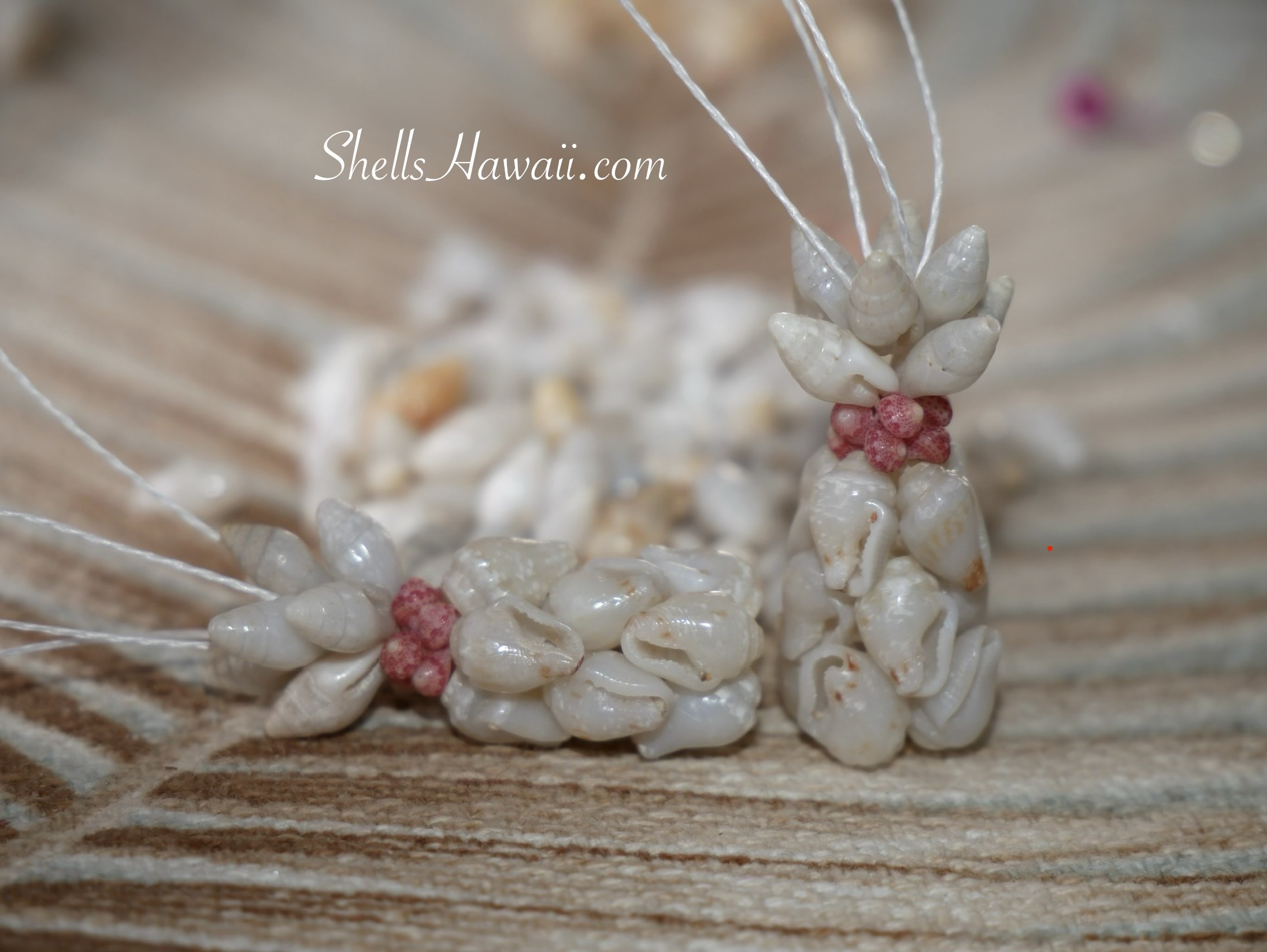 Rare color blue ʻŪliʻuli Momi and Laiki shell earrings with hard to find pink Kahelelani shells in Hawaiian pineapple design, handmade Niʻihau shell jewelry close-up