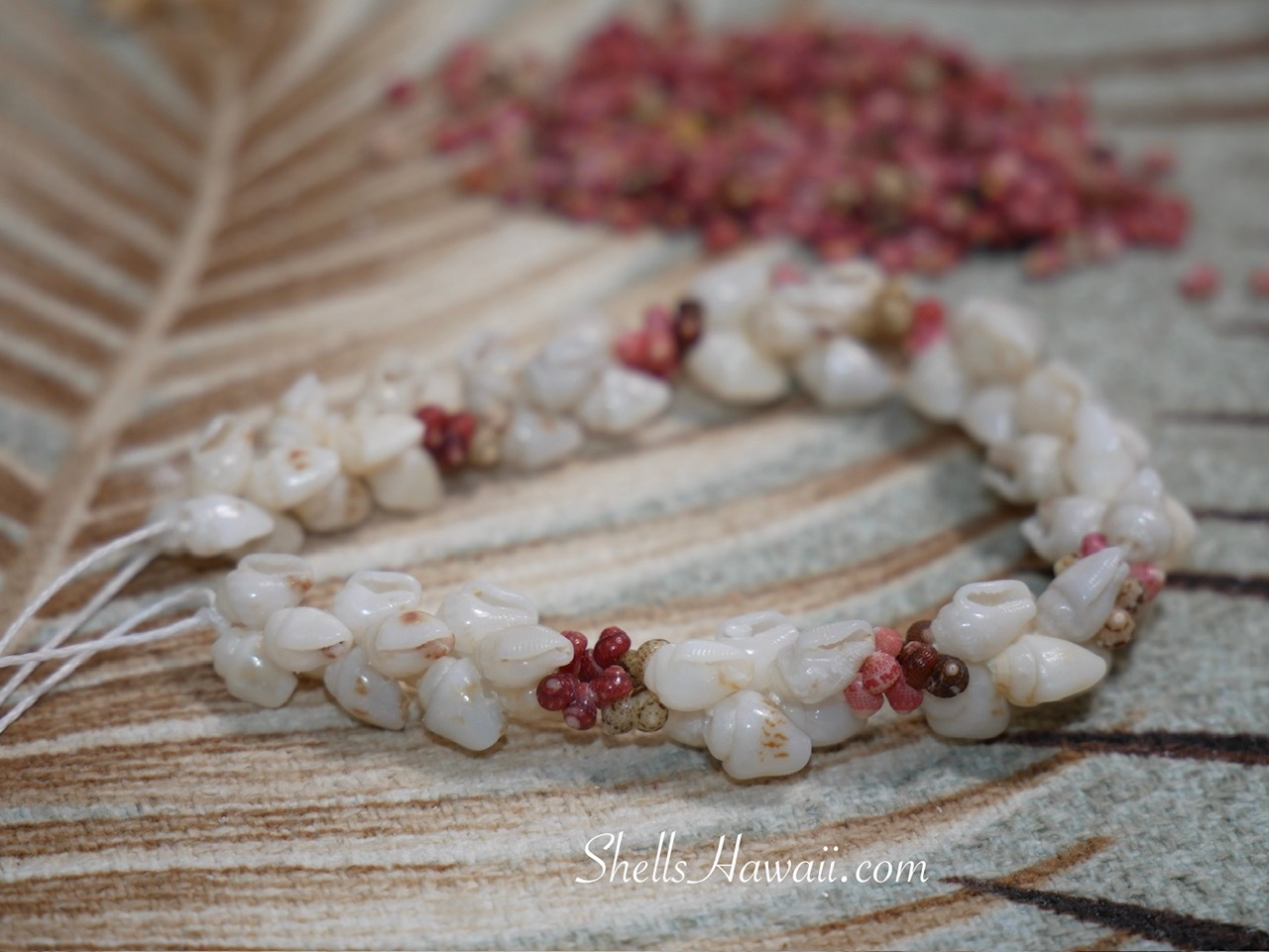 Niʻihau Kipona shell bracelet after replacing cracked Momi shell and re-stringing with Momi and Kahelelani shells
